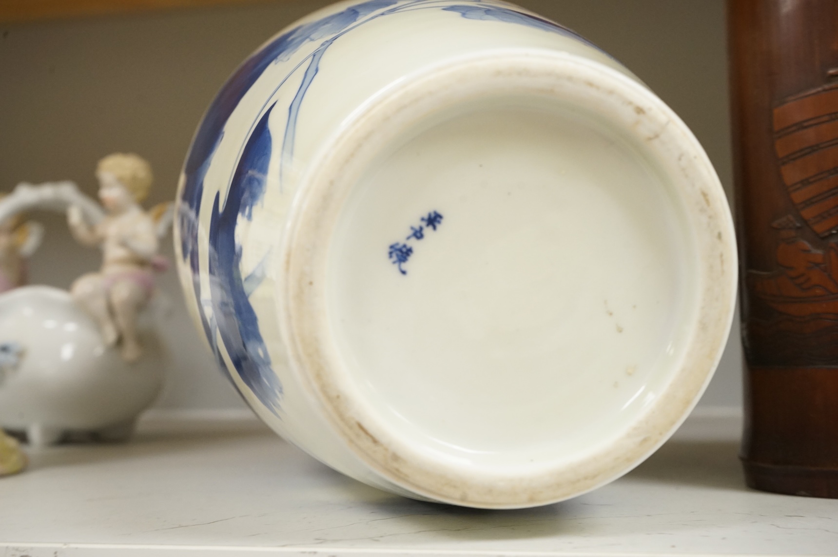 A Chinese Revolution Period porcelain bird group, 21.5cm, a pair of Chinese bamboo brushpots carved with figures and junks, each 22cm high, and a Japanese Seto blue and white vase, 29cm high
